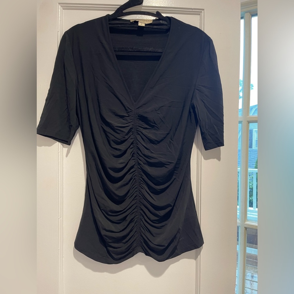 Burberry. Black short sleeve shirt with tissue texture exterior. Size Small.